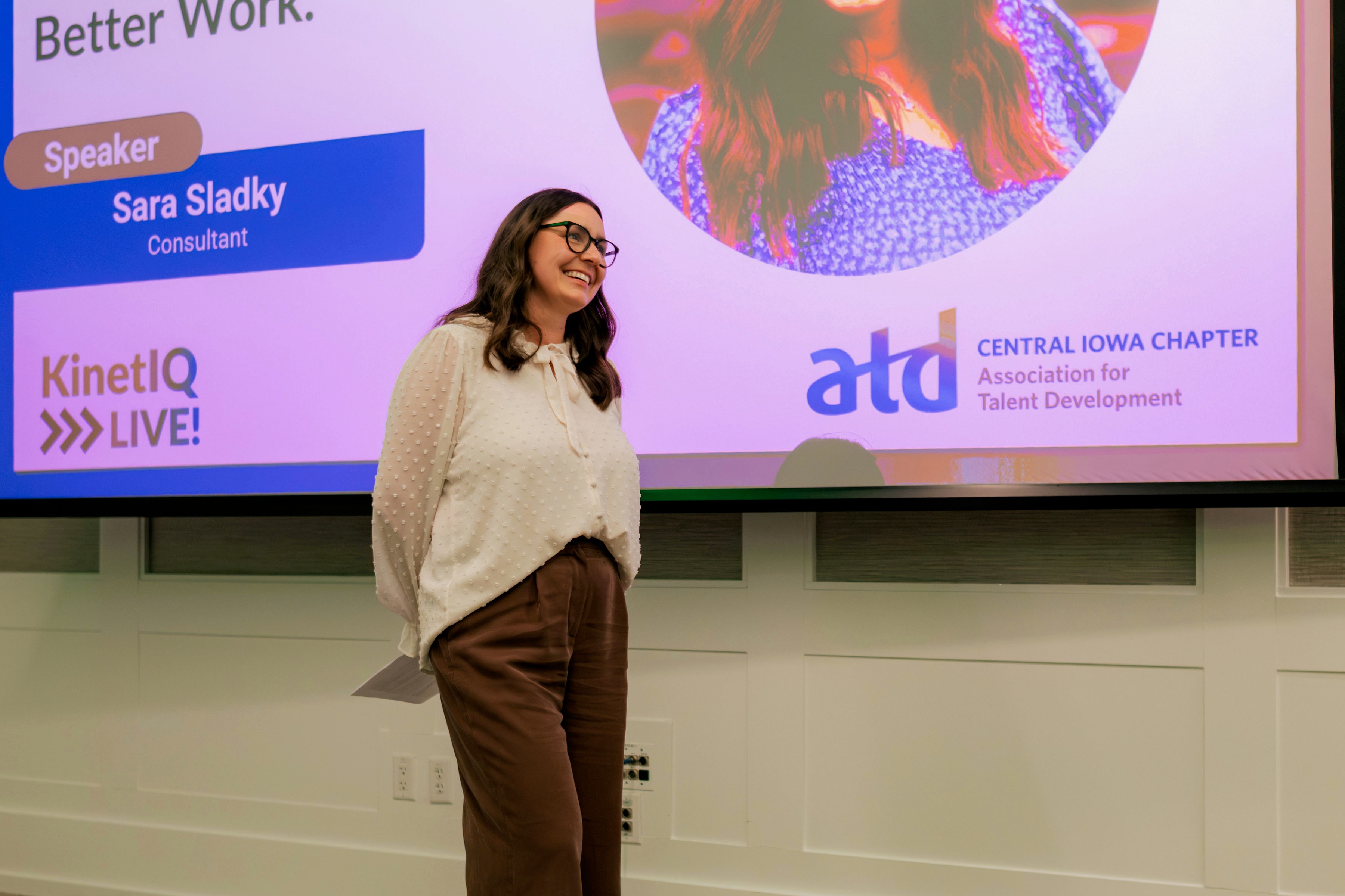 Sara Sladky headshot - woman smiling with brown hair